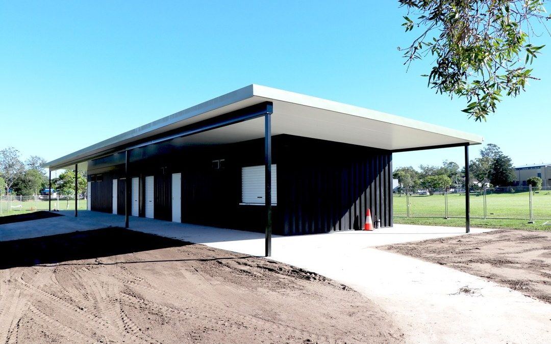 Multi-use shipping container amenities block with flyover roof and white doors for Australian councils and sporting clubs — Container Build Group