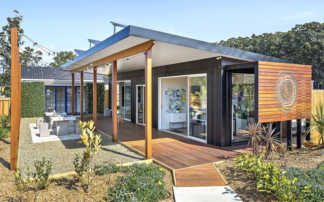 Portable off-grid sales display office exterior with deck glass and solar by Container Build Group