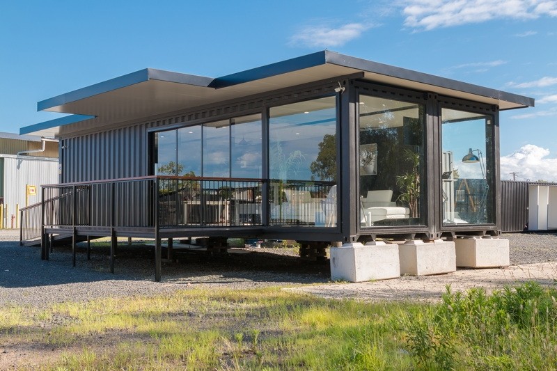 Dual 40ft charcoal container sales office with glass facade