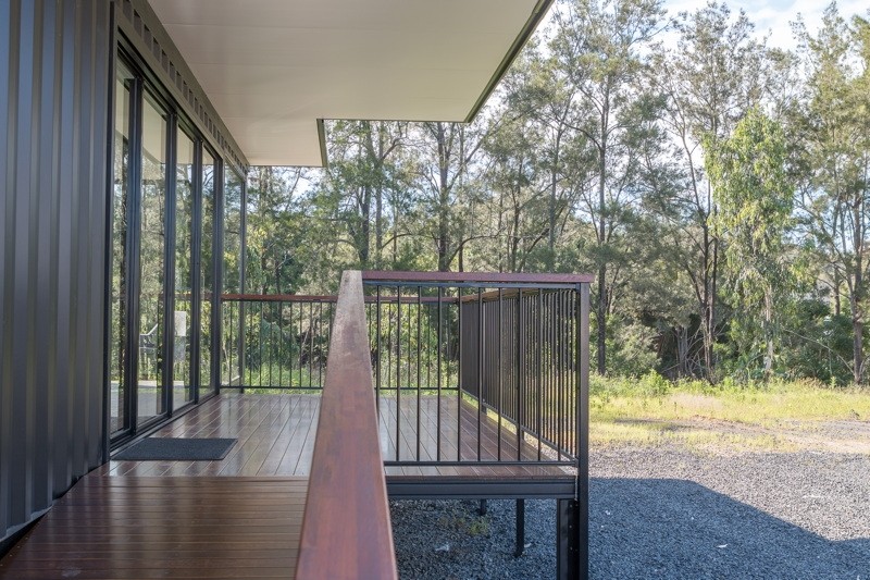 Exterior angle of dual 40ft container office with deck and glass sliding doors