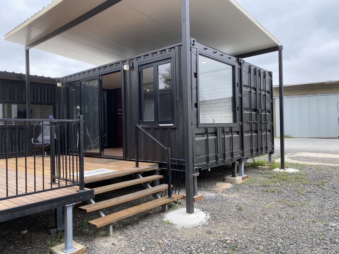 The Big Tiny House, a prefab home made from two 20ft high-cube containers, with deck and stairs