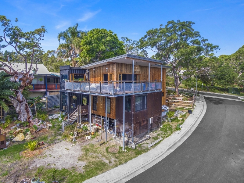 Bundeena two-storey shipping container home exterior on a street corner
