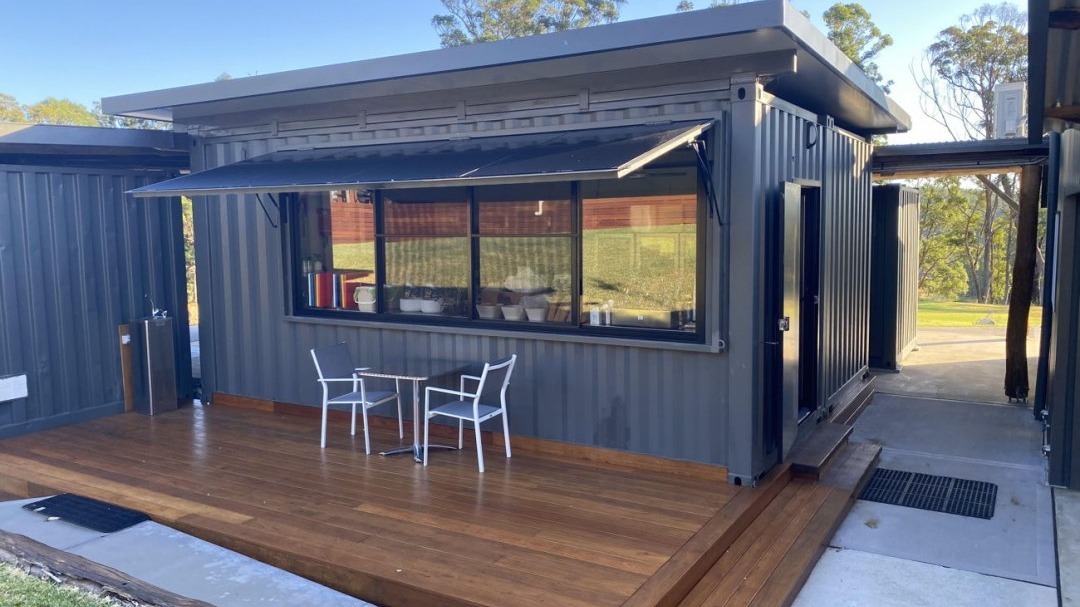 The Mansfield double-width commercial kitchen container with servery window, awning and timber deck