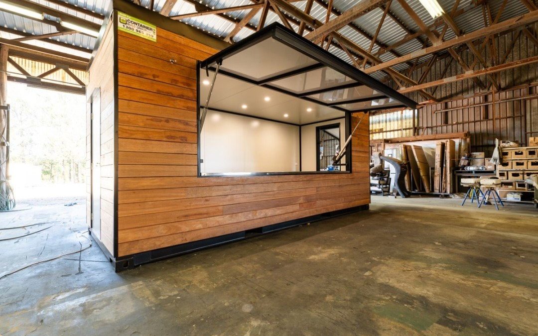 Timber-clad container cafe for Noosa Hills Golf Club with the serving hatch open