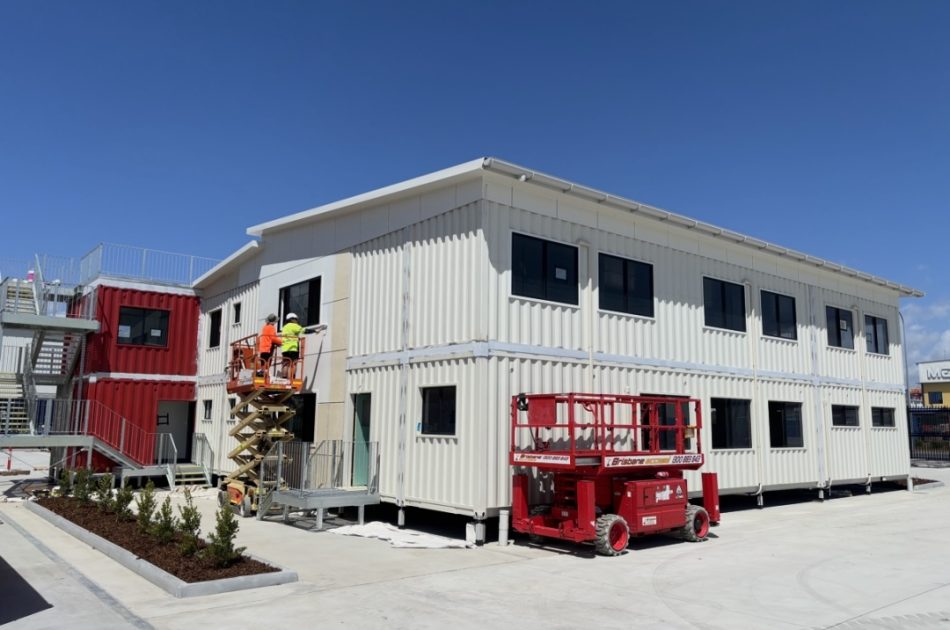 Three-level red and white shipping container commercial building at Port of Brisbane expansion by Container Build Group
