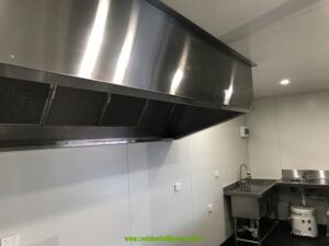 Stainless steel exhaust canopy and sink in a 20ft commercial kitchen container